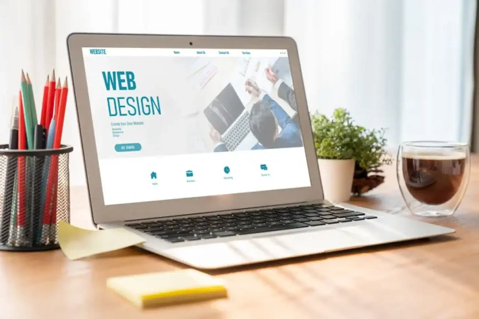 stock photo of a laptop on a desk with the words web design